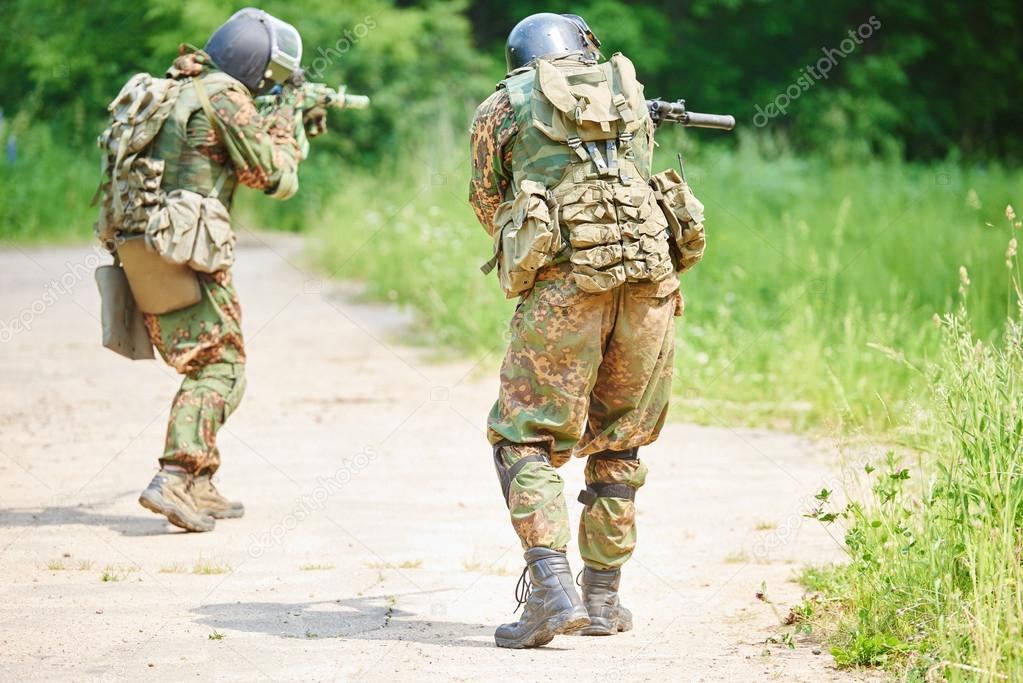 Military soldier with pistol