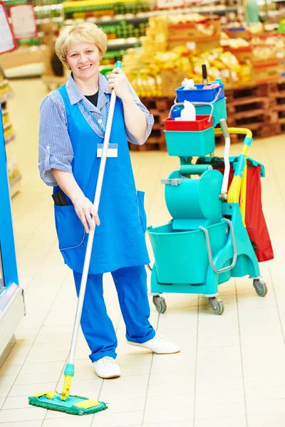 Worker cleaning floor with mop — Stock Photo, Image