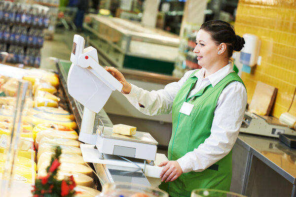 saleswoman in supermarket shop