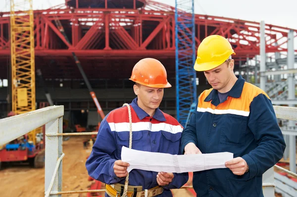 Engineers builders at construction site — Stock Photo, Image