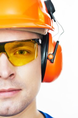 Happy worker in hardhat and overall with thumb up clipart