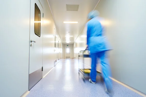 Blurred medic worker passing corridor — Stock Photo, Image