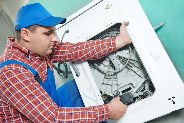 Replacing engine of washing machine — Stock Photo, Image