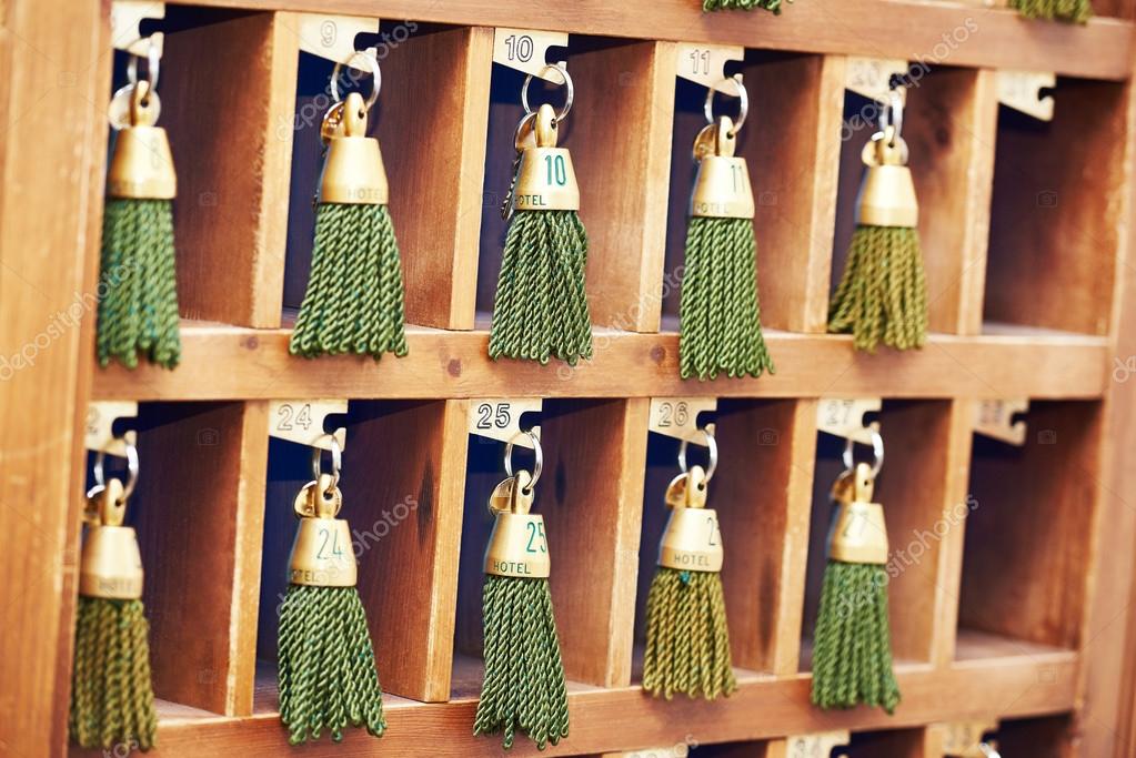 Hotel keys at reception desk counter — Stock Photo © kalinovsky 90873638