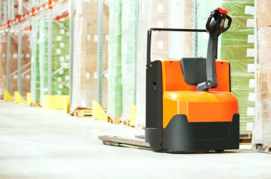 Pallet truck at warehouse clipart