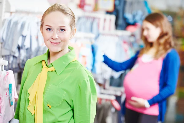Sales assistant or seller in shop — Stock Photo, Image