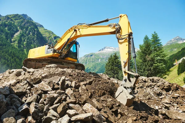 Excavadora cargadora máquina en el sitio de construcción —  Fotos de Stock