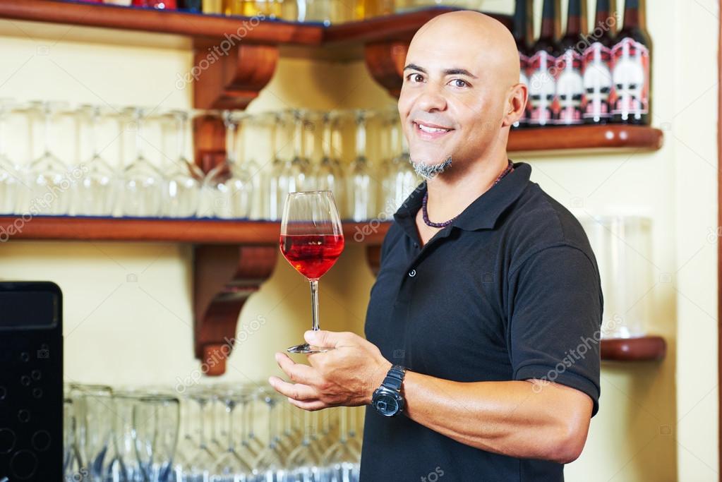 Sommelier barman with glass of water