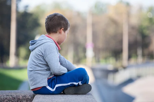 Side View Young Boy Sits Lotus Position Granite Curb —  Fotos de Stock