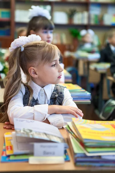Schoolgirl Folded Hand Sitting School Desk Listening — Photo