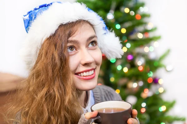 Attractive Woman Blue Santa Hat Holding Hot Tea Mug Hands — Stock Photo, Image