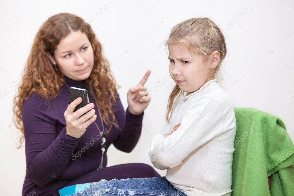 Mom scolding a child for viewing inappropriate content on your smartphone