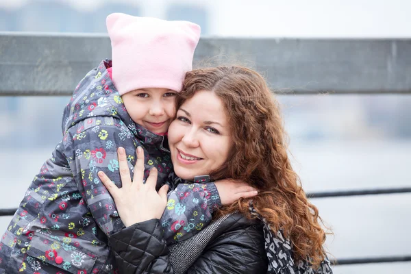 Caucasian Mother Embracing Daughter While Walking Street Head Shoulders Portrait — Stock Photo, Image