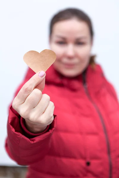 Young Woman Outstretched Hand Holding Paper Heart — Stock Photo, Image