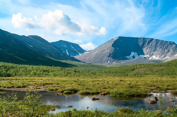 Mountain peaks and tundra at summer season. The Khibiny Massif are the highest mountains of the Kola Peninsula, north of Russia