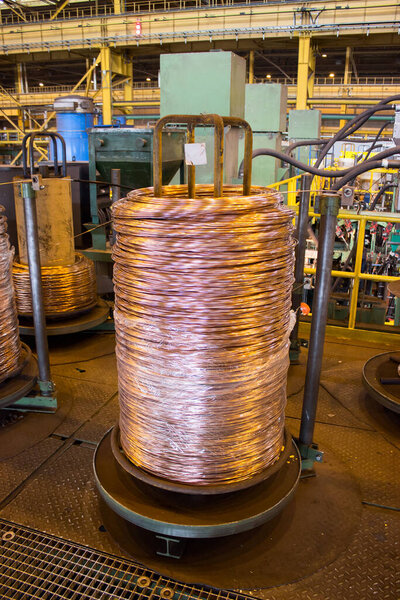 Copper wire rolled up in big bobbin nonferrous metal industry, nobody