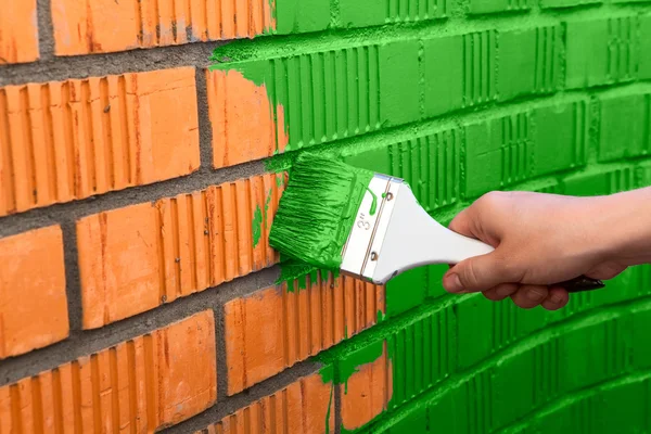 Human hand painting wall — Stock Photo, Image