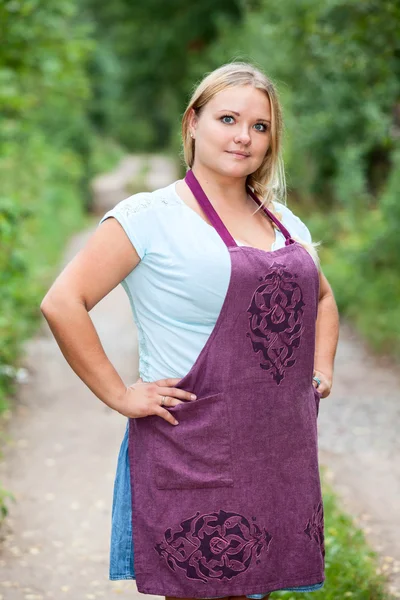 Happy country woman in apron — Stock Photo, Image