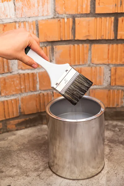 CLear paint brush in human hand — Stock Photo, Image