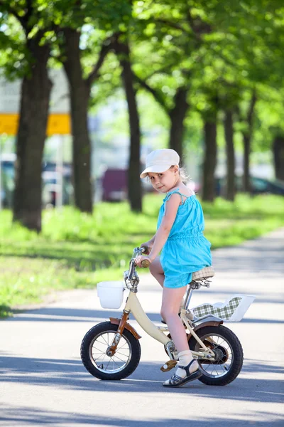 Pretty girl on bicycle — Stock Photo, Image