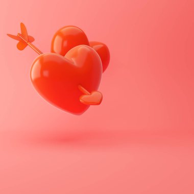 Yumuşak pembe arka planda yüzen okla delinmiş iki parlak kırmızı kalp. 3d hazırlayıcı