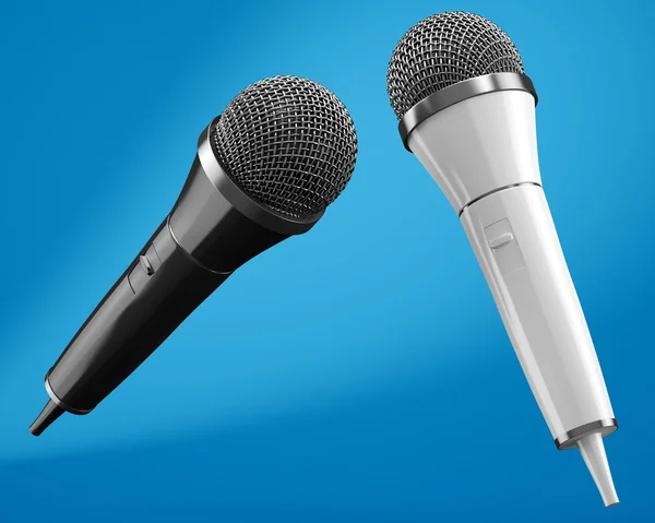 Microfones em preto e branco sobre fundo azul — Fotografia de Stock