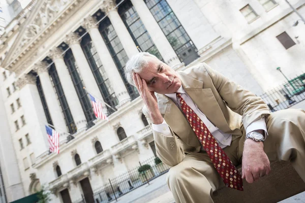 Sad Businessman in front of Wall Street Stock Exchange — Stock Photo, Image