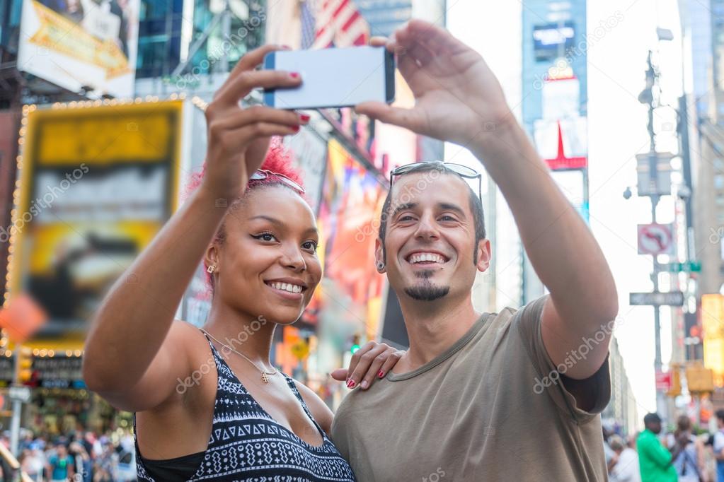 Young Couple Taking Selfie in Times Square