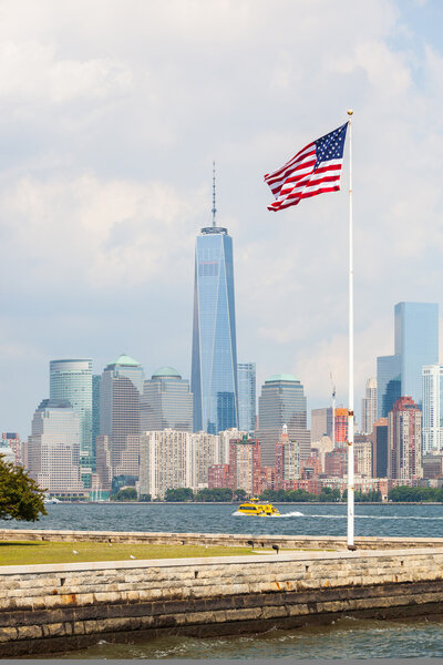 United States Flag with New York Skyscrapers on background