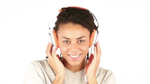 Young Woman Listening Music with Headphones and Flirting with Camera — Stock Video