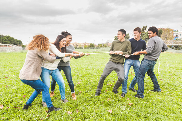 Multiracial People Playing Tug of War