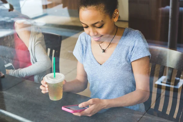 Girl Drinking Coffee in Restaurant Stock Picture