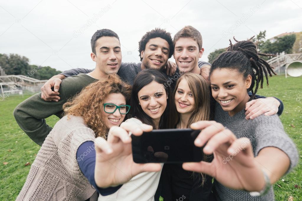 Multiethnic Group of Friends Taking Selfie at Park