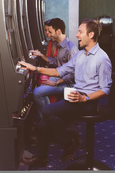 Group of Friend Playing with Slot Machines — Stock Photo, Image