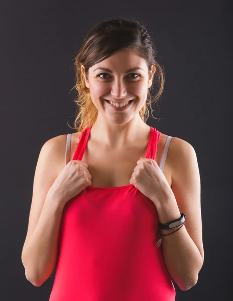 Retrato deportivo de mujer joven sobre fondo negro . — Foto de Stock