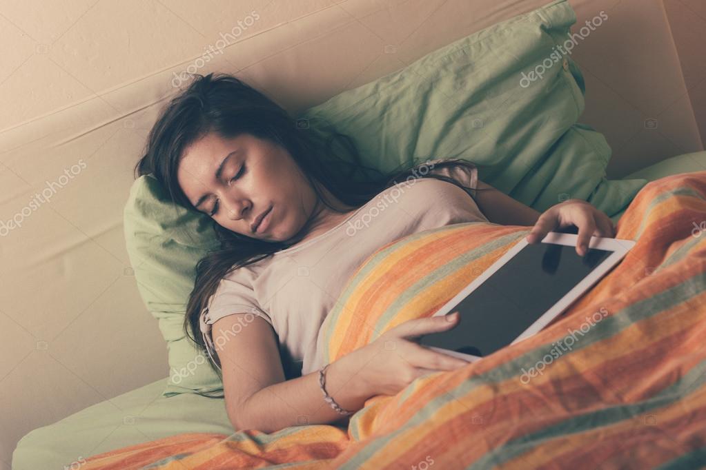 Sleeping Girl Facial Porn - Young Woman Falling Asleep while Using Digital Tablet on Bed Stock Photo by  Â©william87 65074383