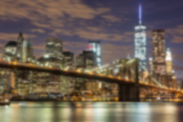 Brooklyn Bridge and Downtown Skyscrapers in New York. Blurred Background.