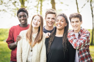 Multiethnic group of teenagers outdoor clipart