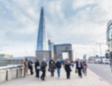Blurred background, tourists and commuters walking on London Bri clipart