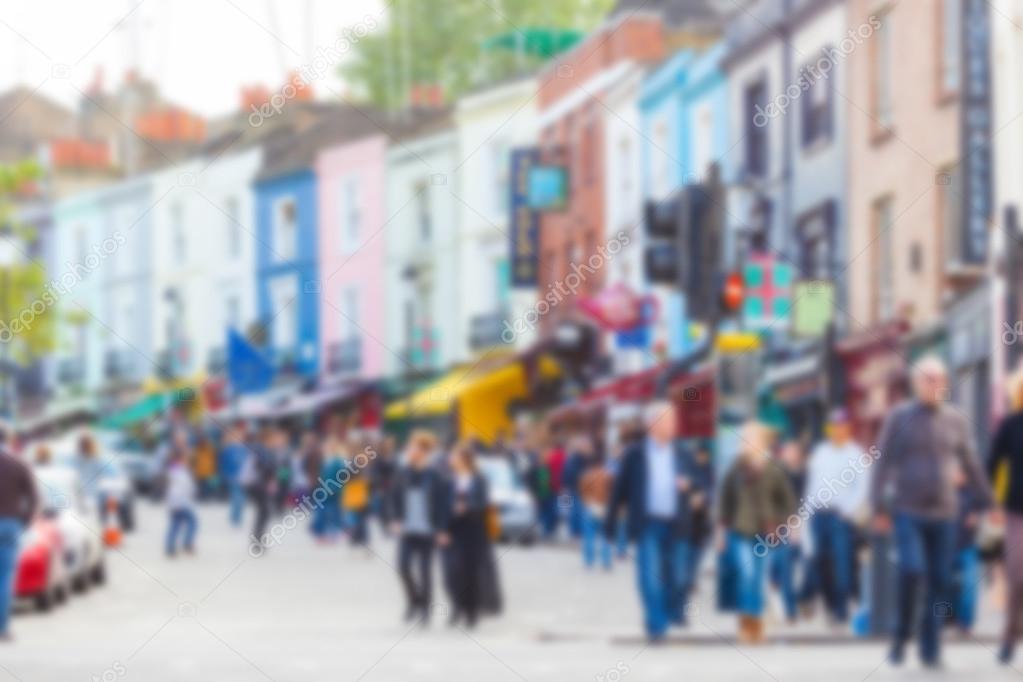 Crowded Portobello road, a famous area in London, blurred backgr