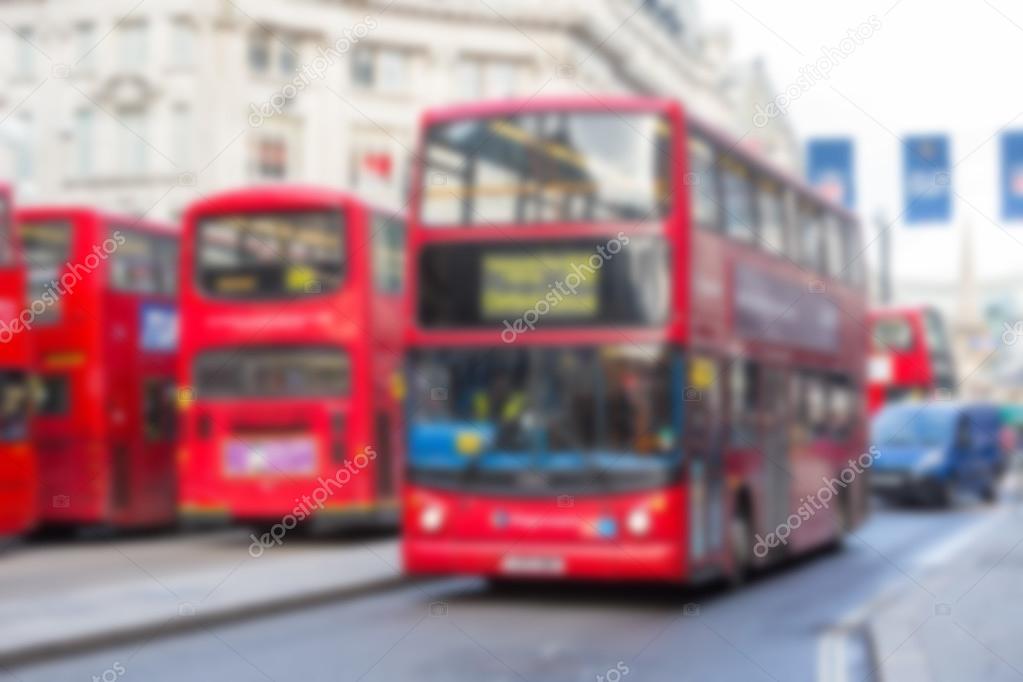 Blurred background with famous London public transport vehicles