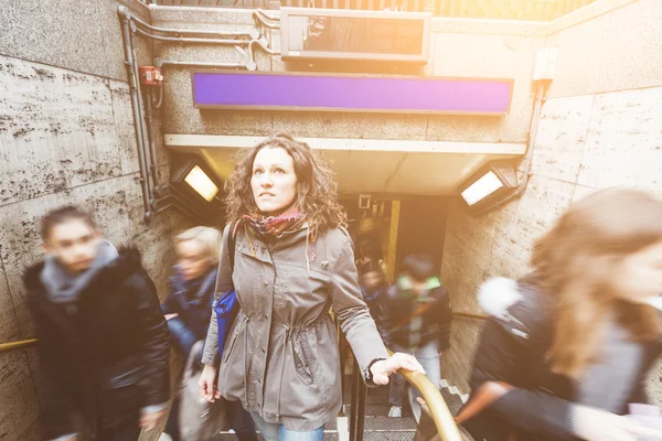 Young woman at tube exit in London — Stock Photo, Image