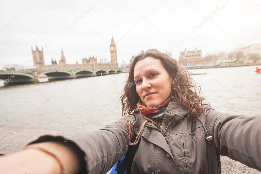 Beautiful woman taking a selfie in London