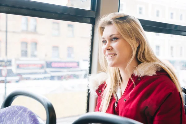 Beautiful young woman in London on double decker bus — Stock Photo, Image