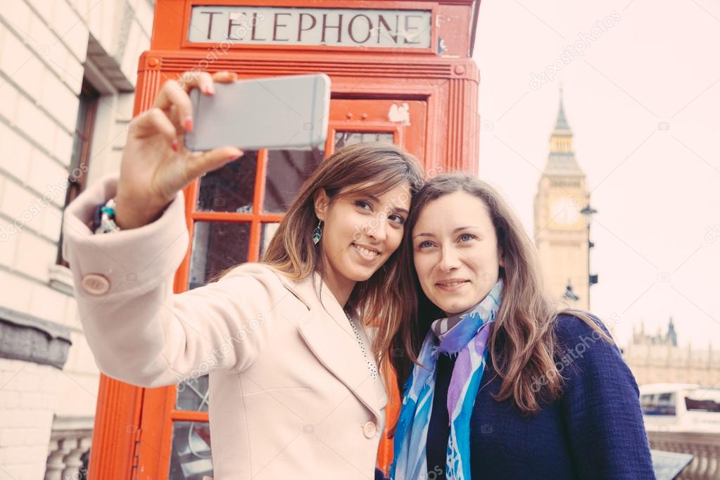 Two women taking a selfie in London.