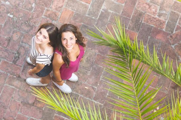 Portrait of two beautiful girls taken from above. — ストック写真