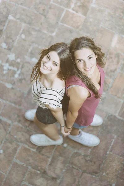 Portrait of two beautiful girls taken from above. — ストック写真