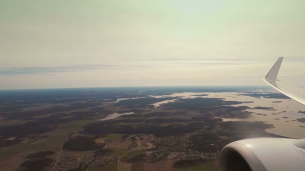 Airplane flying at low altitude over sea and islands — Stock Video