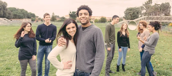 Multiethnic couple embraced at park — ストック写真