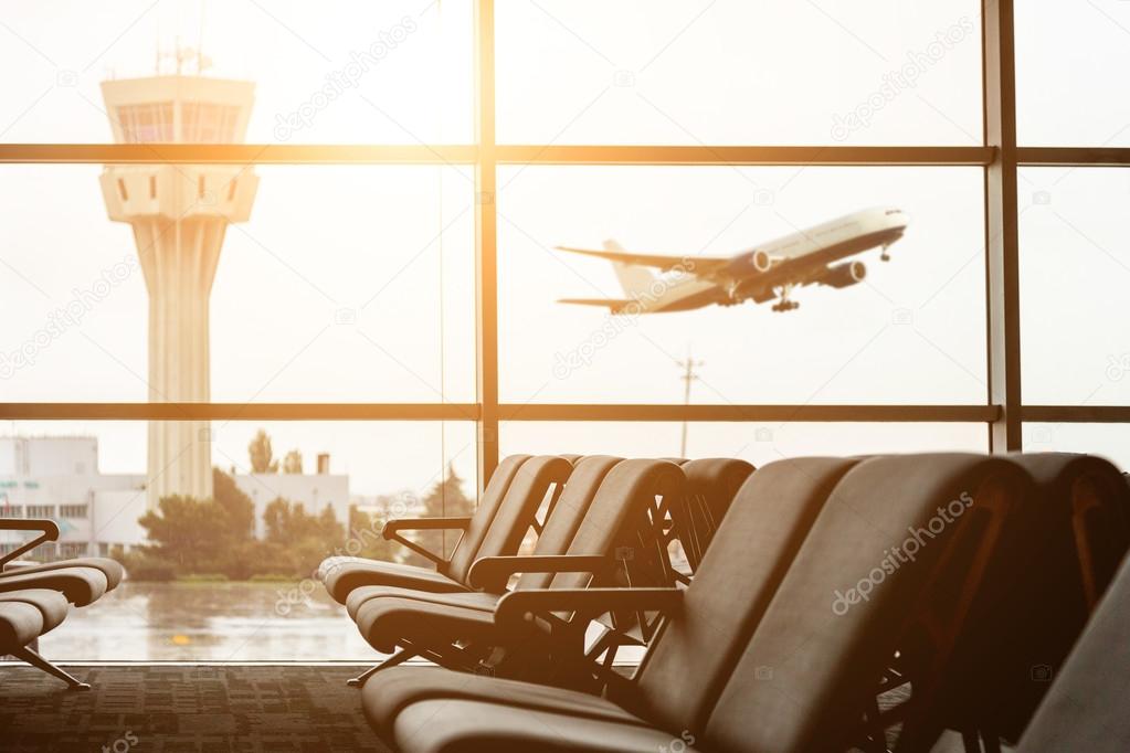 Airport departure all with control tower and airplane on backgro